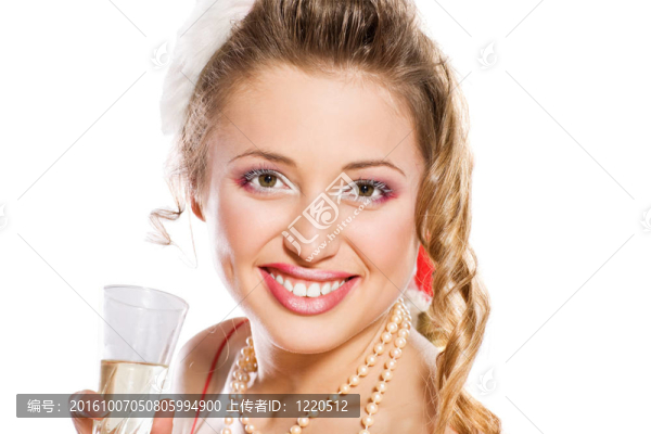 迷人的女孩在Santa與香檳酒杯帽子