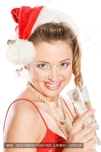 迷人的女孩在Santa與香檳酒杯帽子