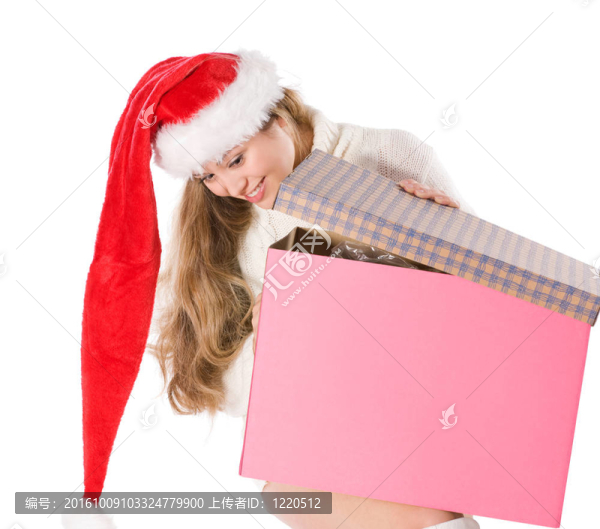 迷人的女孩在Santa與裝飾盒帽子