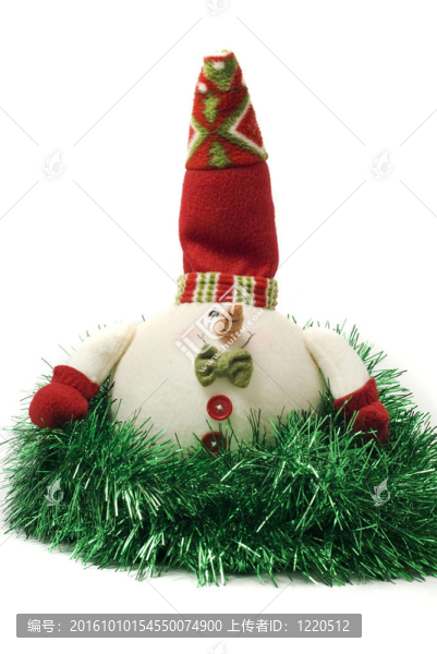 毛絨玩具圣誕雪人在綠色的金箔