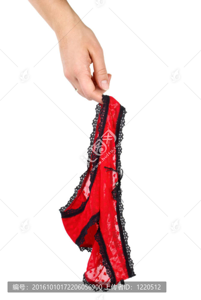 性感女性的紅色蕾絲內(nèi)褲掛在手指