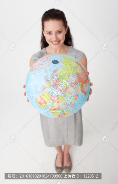 年輕的女商人控股的地球星球