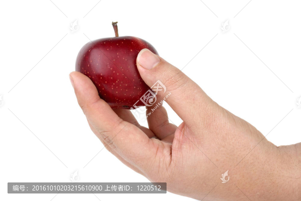 一手拿著小的紅蘋(píng)果