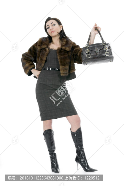 帶手提箱的年輕女子