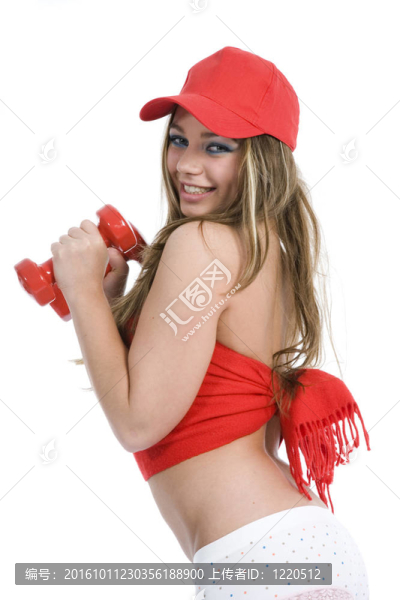 美麗的女孩用啞鈴