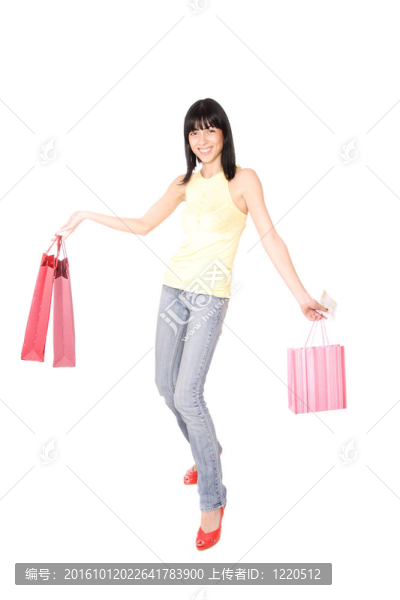 帶購(gòu)物袋的快樂(lè)女人