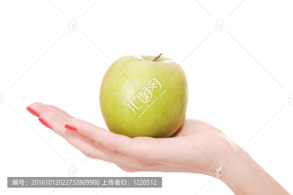 新鮮的綠色蘋果在手