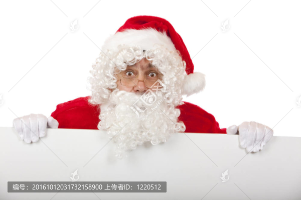 圣誕老人持有一個(gè)白板空白的特殊圣誕優(yōu)惠，看起來很驚訝。白色孤立。