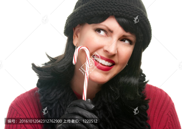 漂亮的女人拿著糖果手杖