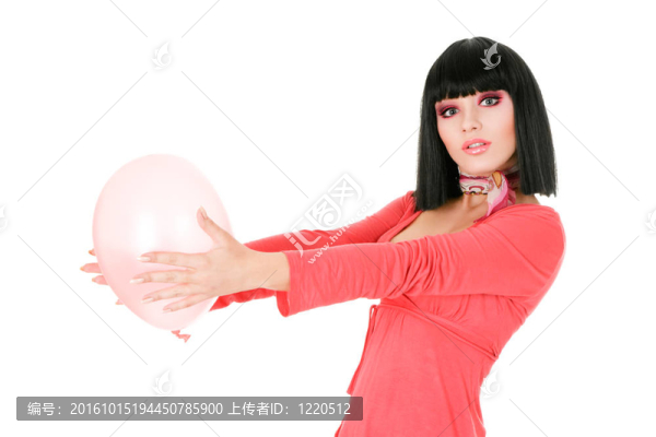 性感的年輕女子拿著氣球