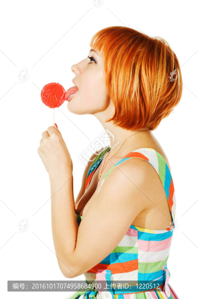 美麗的紅色女孩與糖果