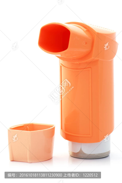 橙色的哮喘吸入器和罩