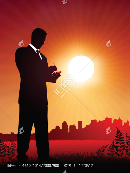 工作在夕陽背景的商人