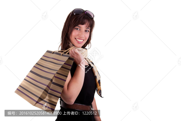 快樂購物袋女孩；孤立的白色背景。工作室拍攝。