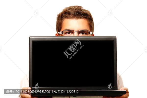 一個拿著電腦的商人