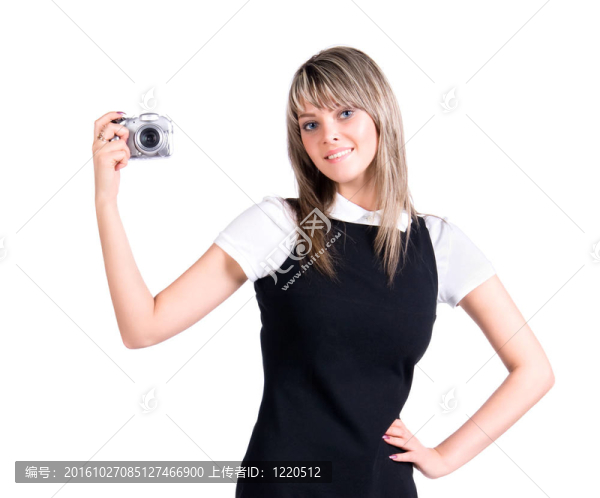 年輕女子手持?jǐn)?shù)碼相機(jī)