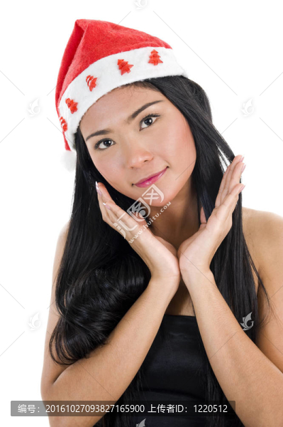 戴著圣誕老人帽子和空白名片的女人