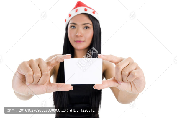 戴著圣誕老人帽子和空白名片的女人