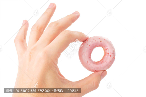 可愛的迷你甜甜圈的男人的手