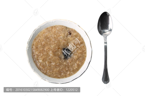 勺子和一個有一個粥的盤子