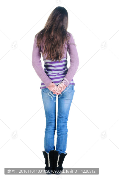 美麗的年輕女人看著墻。后視圖。