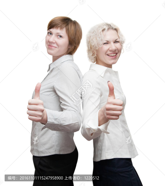 快樂的businesswomans豎著大拇指。關(guān)注手