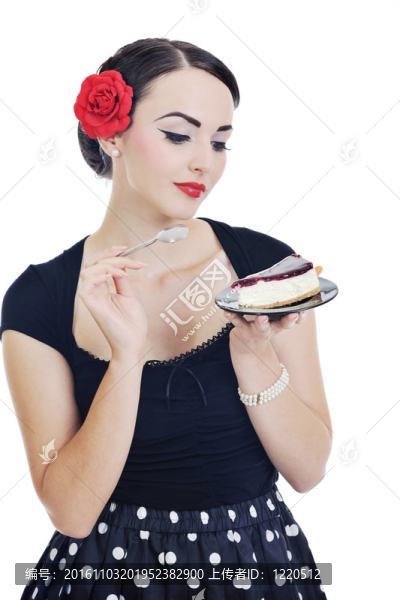 美麗的年輕女人吃甜蛋糕