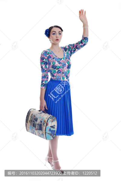 精致的女人與復古旅行袋分離