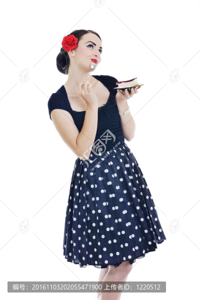 美麗的年輕女人吃甜蛋糕