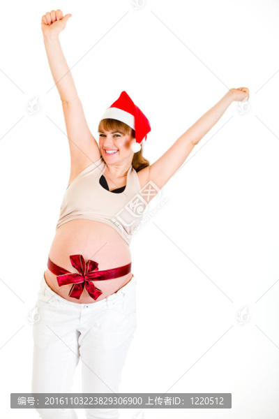快樂的圣誕孕婦在Santa舉起帽子，雙手在白色上孤立