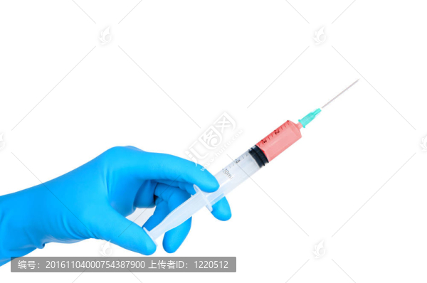醫(yī)用橡膠手套手持醫(yī)用注射器。
