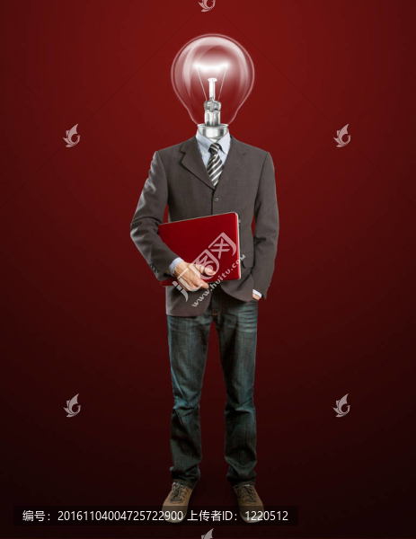 男子在西裝與燈和筆記本電腦在他的手中