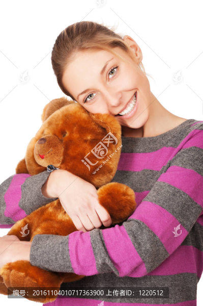 美麗的年輕女子與泰迪熊孤立的白色背景