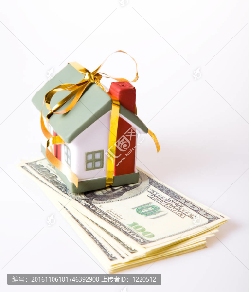 帶金弓的玩具小房子。住宅買賣觀念。