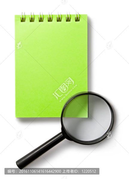 白色的記事本和放大鏡