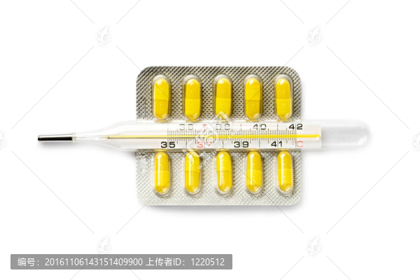 白色的體溫計(jì)和藥片