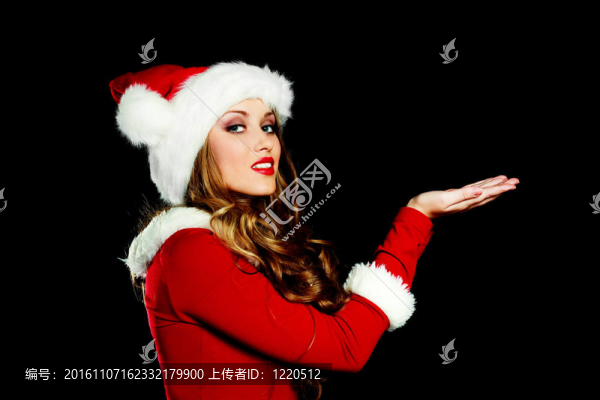 年輕的女人打扮成Santa