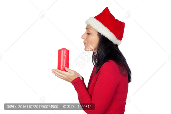 美麗的女孩在圣誕節(jié)吹蠟燭