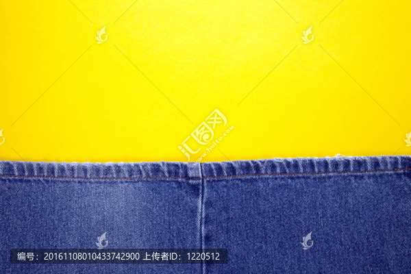 黃色背景的藍色牛仔褲