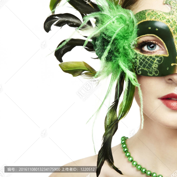 年輕美麗的綠色神秘的威尼斯面具的女人