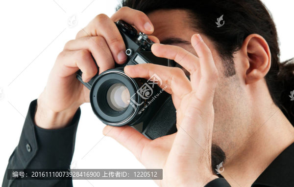 帶數(shù)碼相機的攝影師