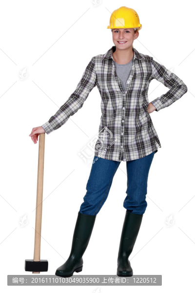 幸福的女人站在大錘