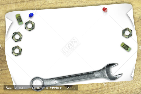 空白的紙上用扳手和螺母