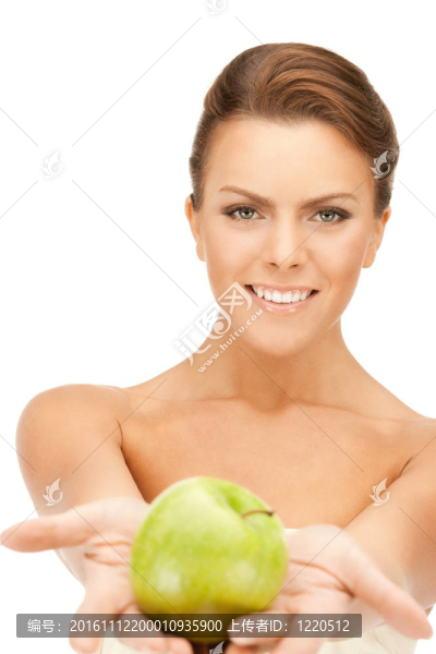 年輕美麗的女人和綠色的蘋果