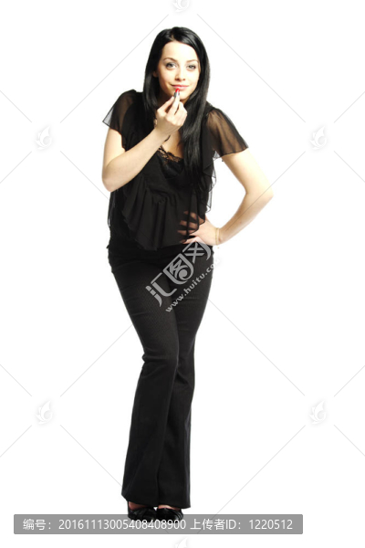 漂亮的年輕女人手里拿著口紅