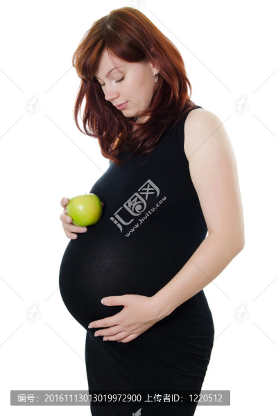 懷孕的女人和一個蘋果