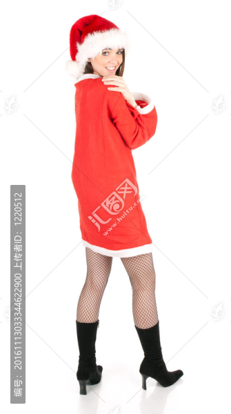 微笑的年輕女子穿著紅色的Santa衣服和帽子