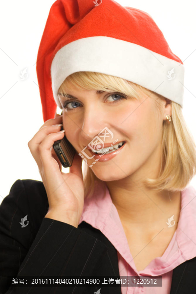 Chrismtas帽的電話會談生意的女人。白色背景中分離