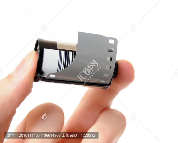 手拿著膠卷筒