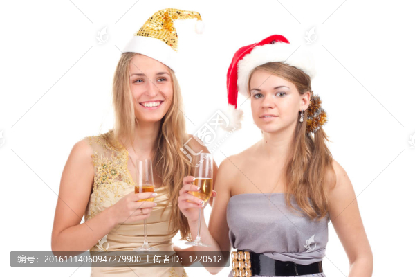 兩個女孩用手拿禮物和眼鏡慶祝圣誕節(jié)